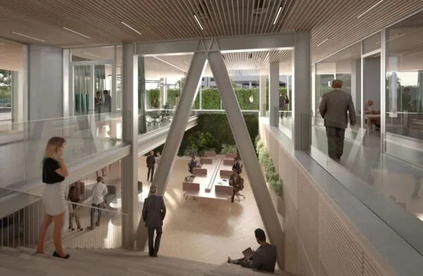 Moderne kantoorruimte aan de Marten Meesweg met glazen wanden, open werkplekken en een groene binnentuin.